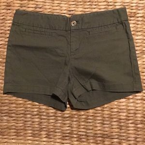 Button fly green shorts